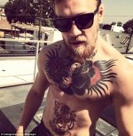 2796355300000578-0-Conor_McGregor_reveals_his_new_tattoo_of_a_tiger_on_his_stomach_-m-9_14290881.jpg