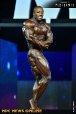 Shawn Rhoden Side Bicep Olympia Winner.webp