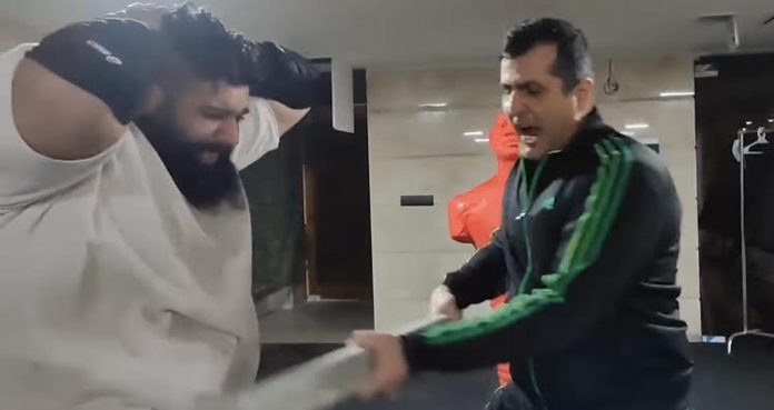 Iranian Hulk Shows Crazy Training Methods That Include Getting Hit With Wooden Boards