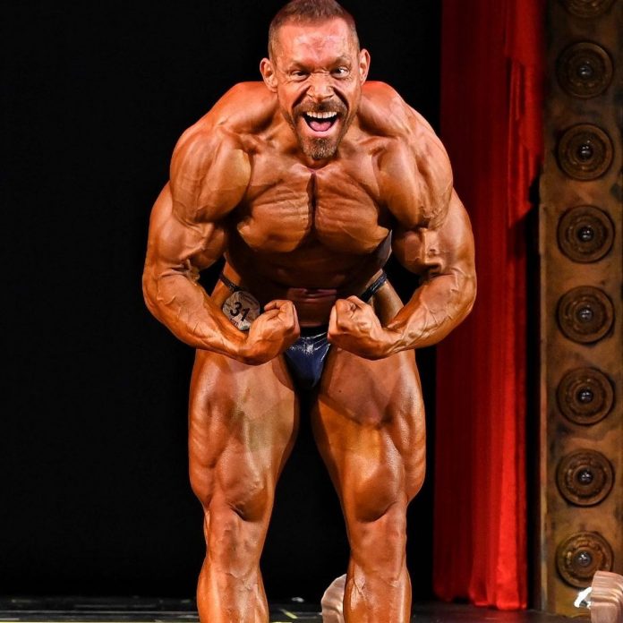 Natural Olympia Reigning Champ Paul Krueger Exhibits Favorite Exercise for Monster Shoulders