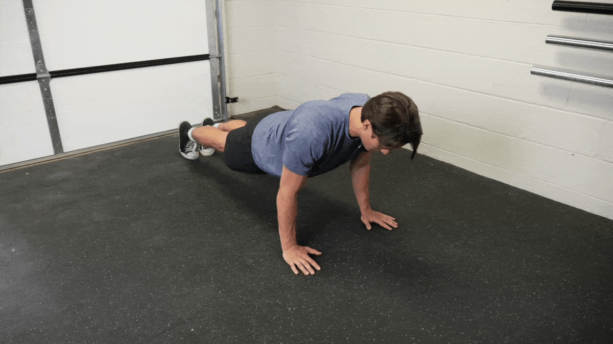 A person performing the push up exercise.