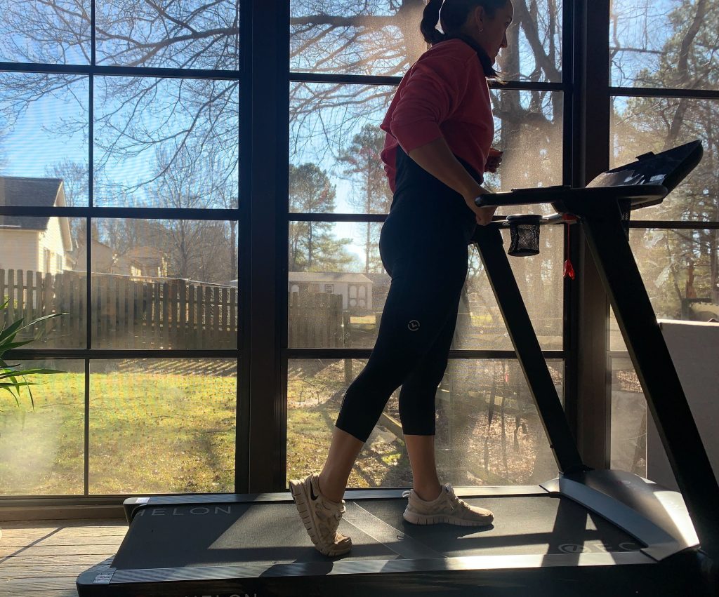 A woman walking on the Echelon Stride treadmill