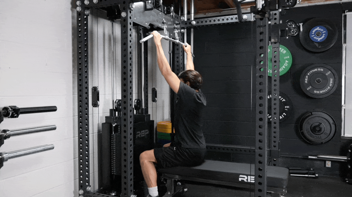 A person performing the lat pulldown exercise.