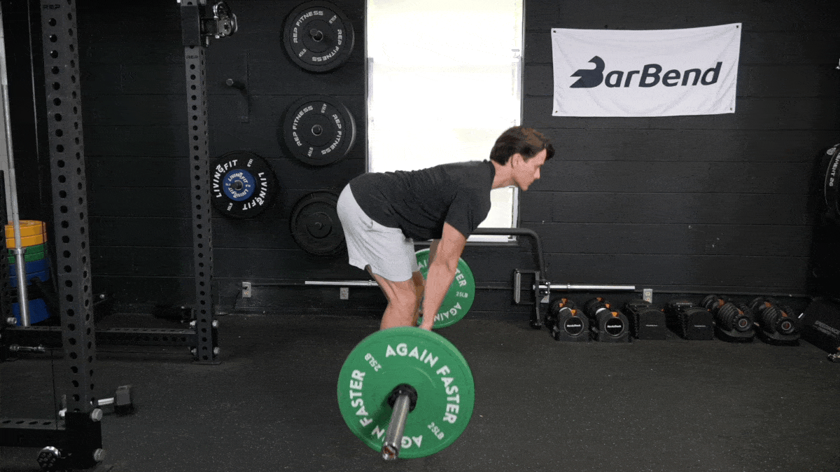 A person performing the deadlift exercise.