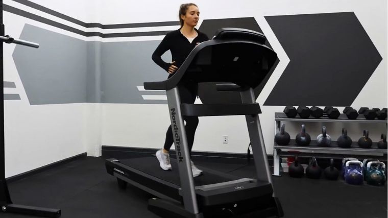 A person doing hiit workout on a treadmill.
