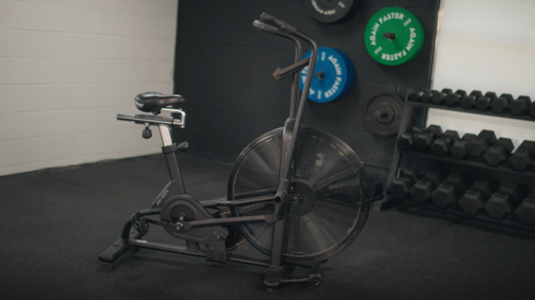An Assault AirBike is shown in a gym