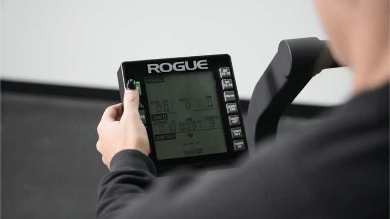 rogue-echo-air-bike-close-up-pressing-start-button-on-screen-controls.jpg