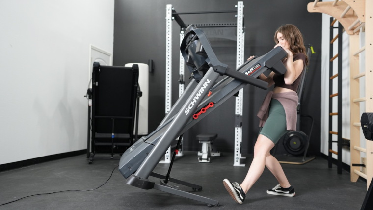 Our Tester moving the folded Schwinn 810 Treadmill.