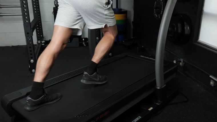 A person working out on a treadmill.